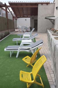 Porche, solarium y barbacoa