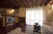 Salón, cocina y chimenea de leña