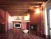 Salón, cocina y chimenea